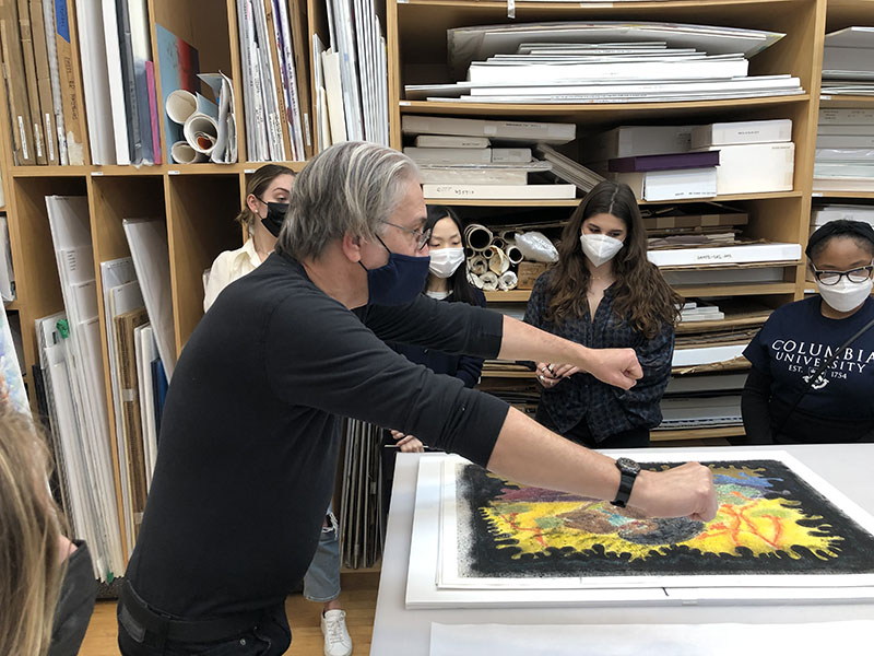 MA students with Craig Zammiello at the Two Palms studio, looking at a Chris Ofili woodcut monoprint (2/17/22)