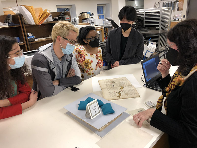 MA students with Alexis Hagadorn at the Conservation lab, learning about paper conservation (4/14/22)